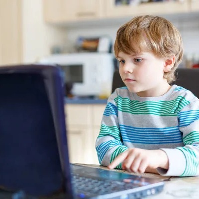 depositphotos 142305618 stock photo kid boy surfing internet and